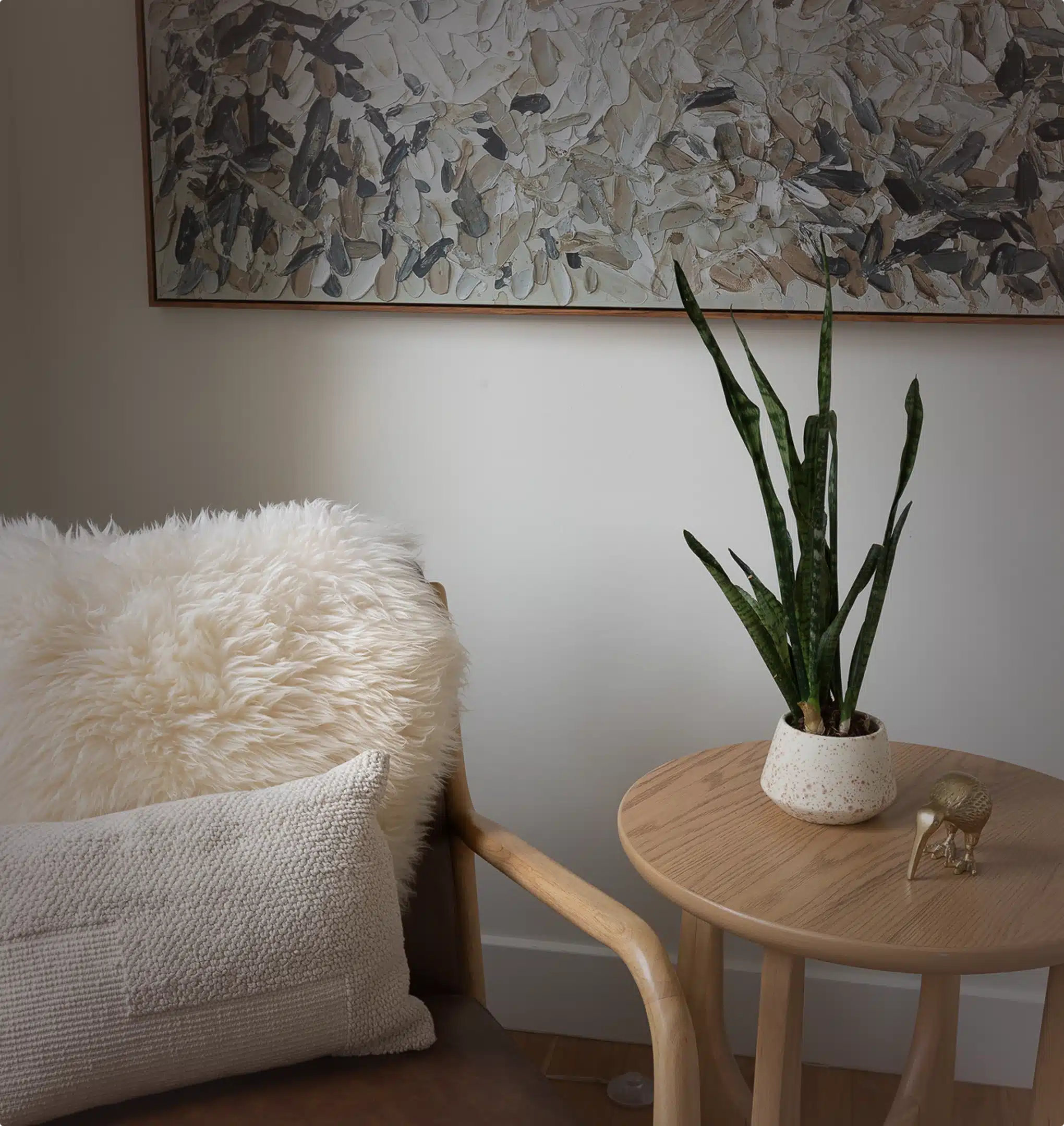 Cozy chair with plant and artwork