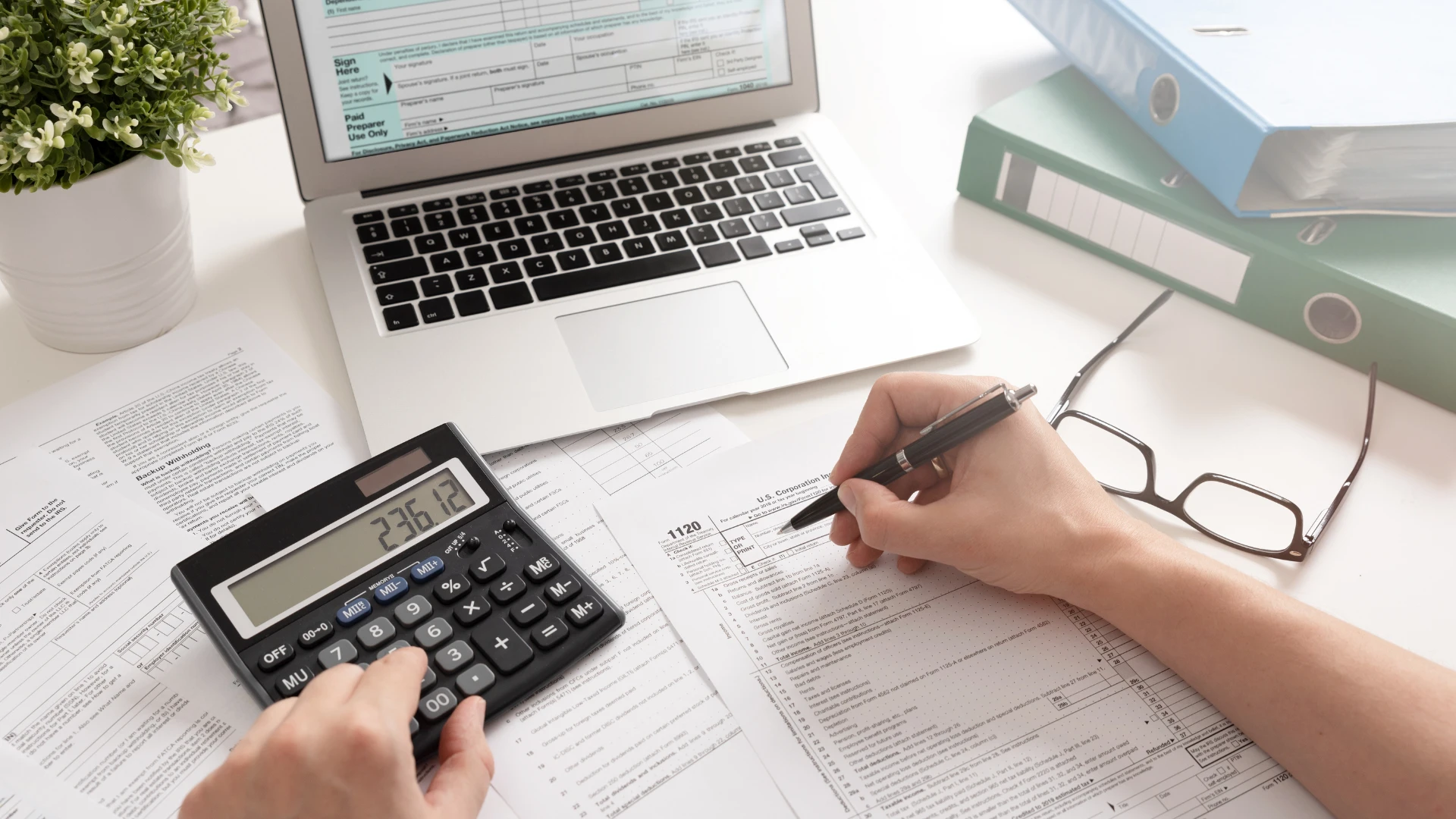 A step-by-step guide on filing taxes for free, featuring a checklist and computer screen with tax software.