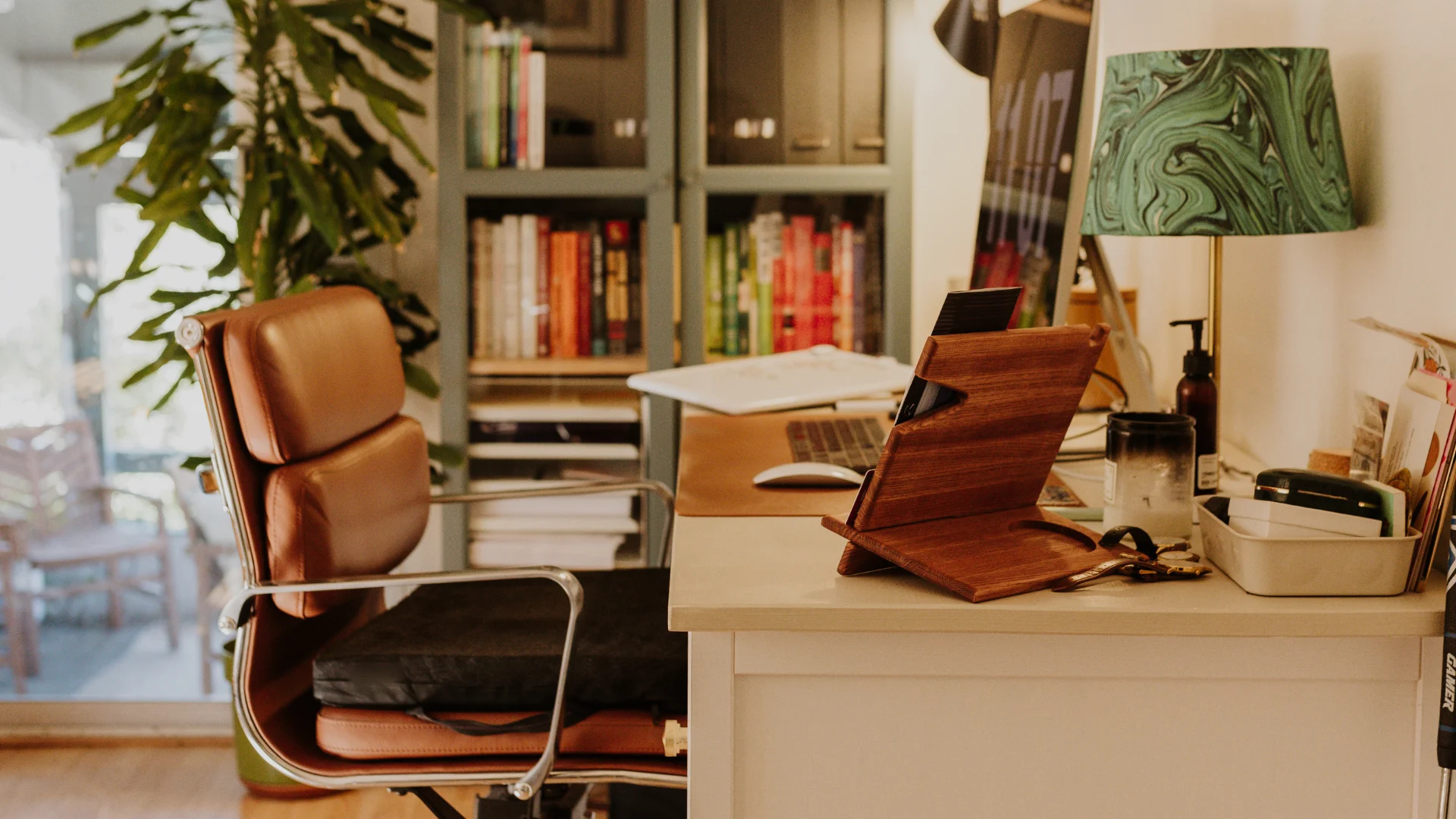 A desk featuring a laptop and a lamp, creating a functional workspace environment.